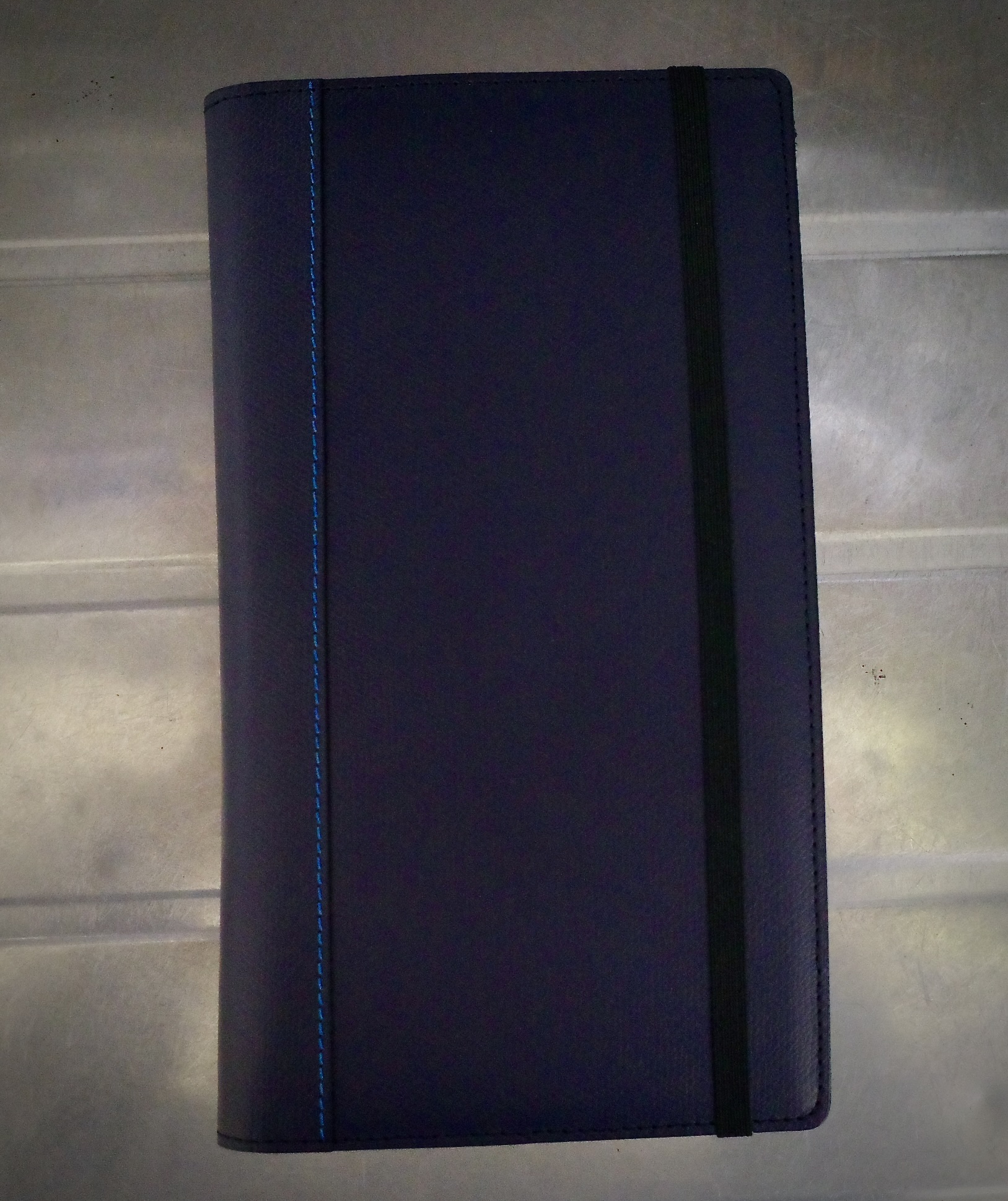 An image of a diary cover, colored navy blue