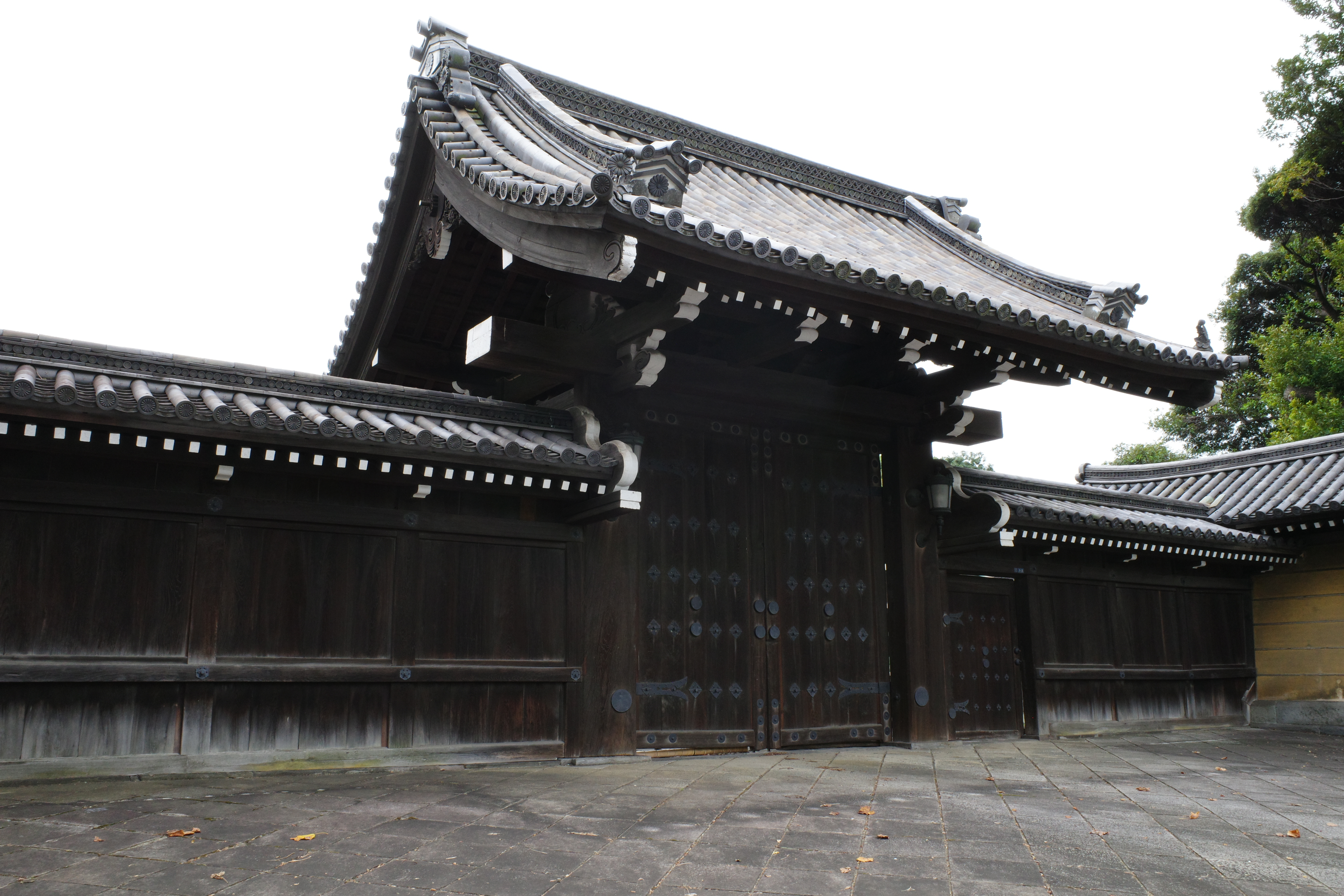 An image of an old Japanese gate made of wood